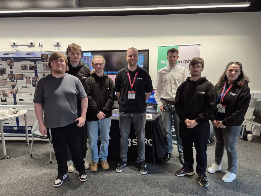 The metamorphic team and their tutor at the intercollege expo